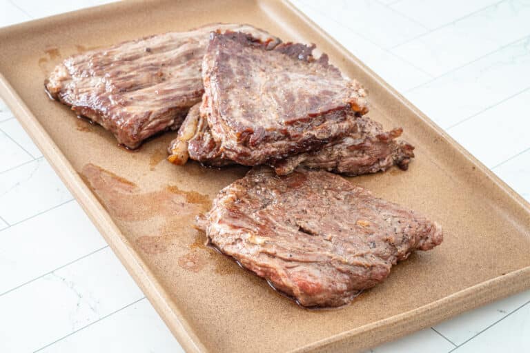 Preparing the steak for the Philly cheesesteak skillet.
