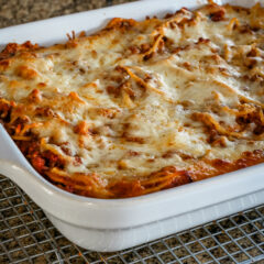 A baked spaghetti casserole on a cooling rack