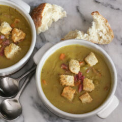 bowls of split pea soup and croutons