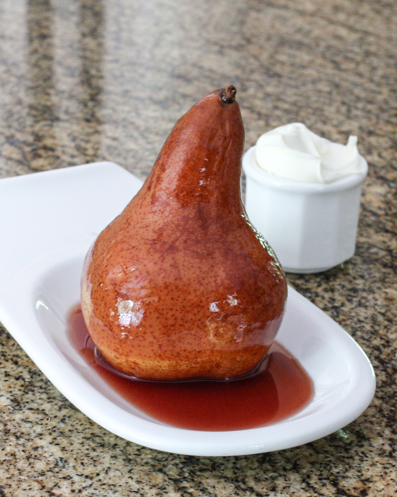 slow cooker wine poached pear on a serving dish