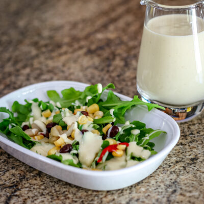 Sour cream dressing on a small salad