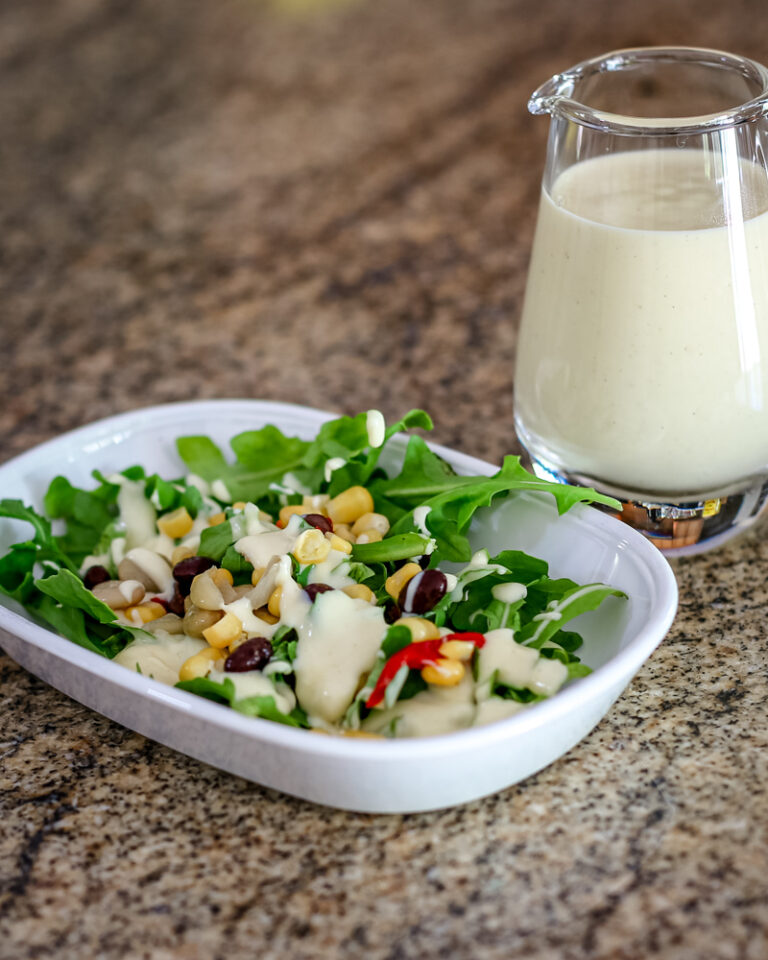 Sour cream dressing on a small salad