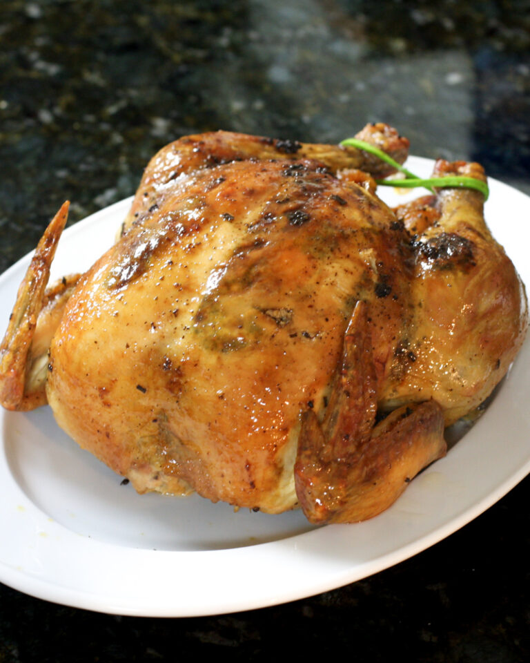 a sriracha glazed roast chicken on a platter