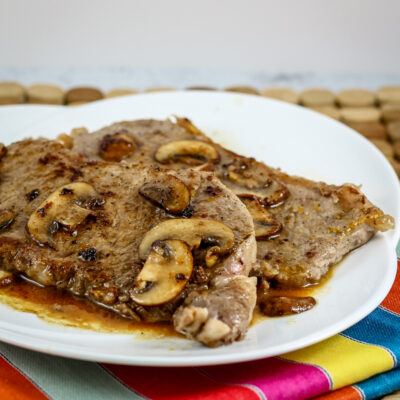 Steak Diane with sauce on a serving platter