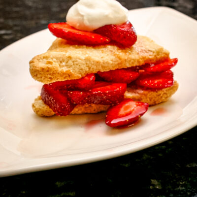 Strawberries and whipped cream-filled sweetened scones.