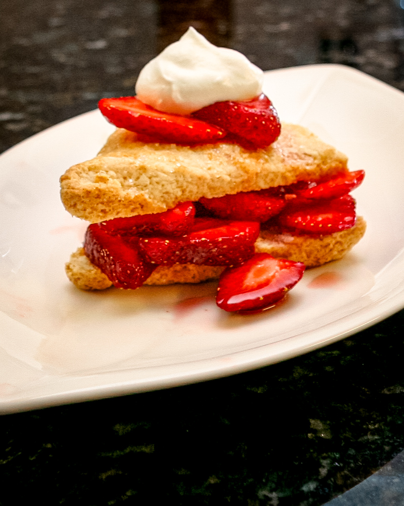 Strawberries and whipped cream-filled sweetened scones.