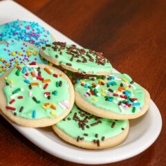 sugar cookies with royal icing on a small plate