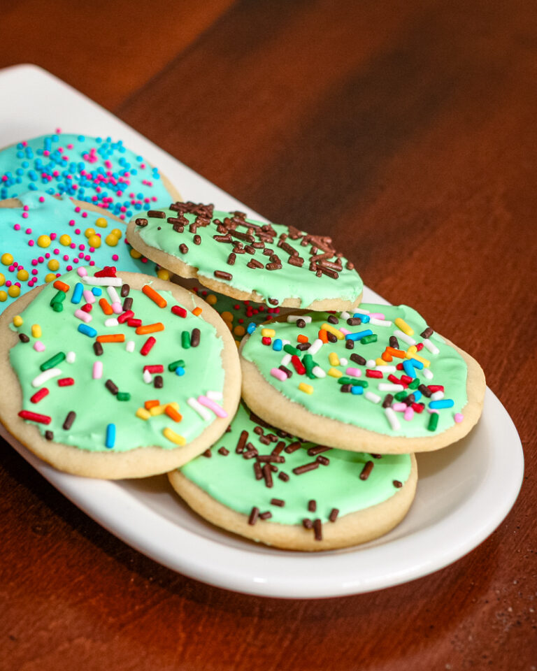 sugar cookies with royal icing on a small plate