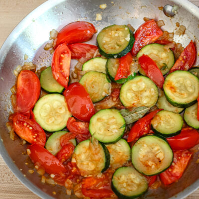 zucchini and tomatoes in a skillet