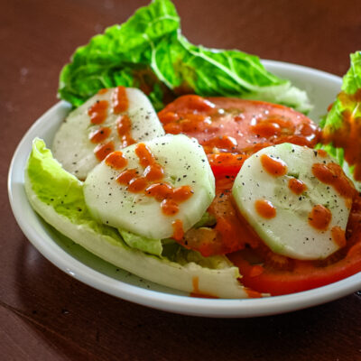 French dressing drizzled on a salad.