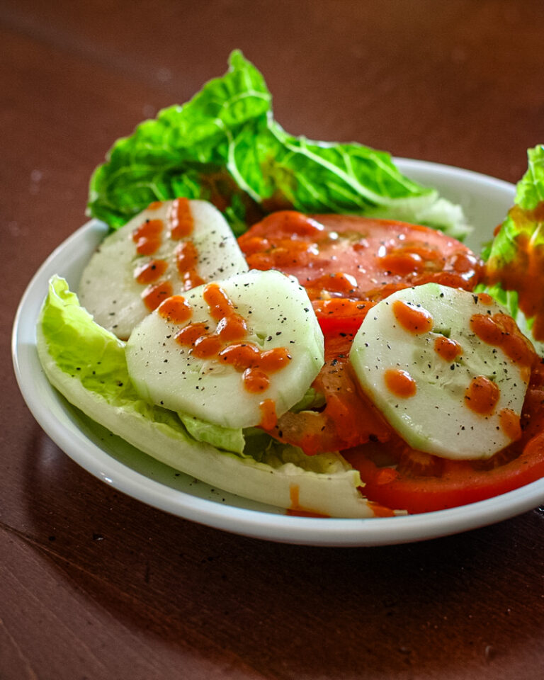 French dressing drizzled on a salad.