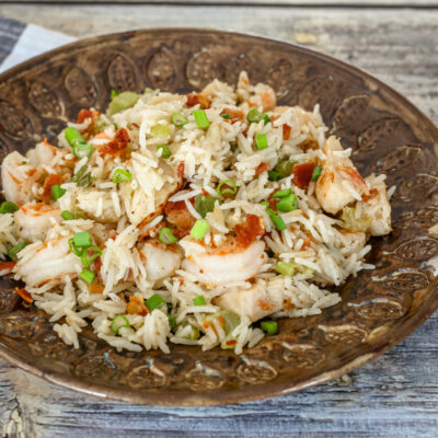 Shrimp and rice skillet on a serving plate.