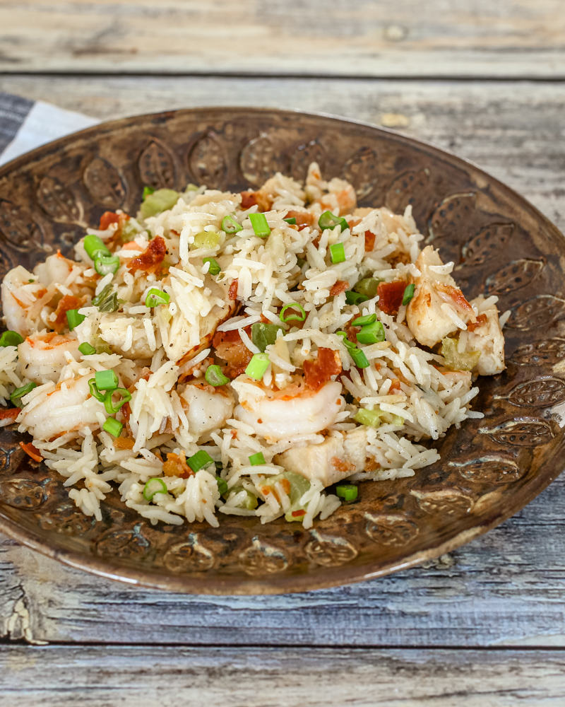 Shrimp and rice skillet on a serving plate.