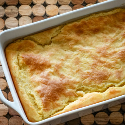 A baking dish with old-fashioned spoonbread, baked