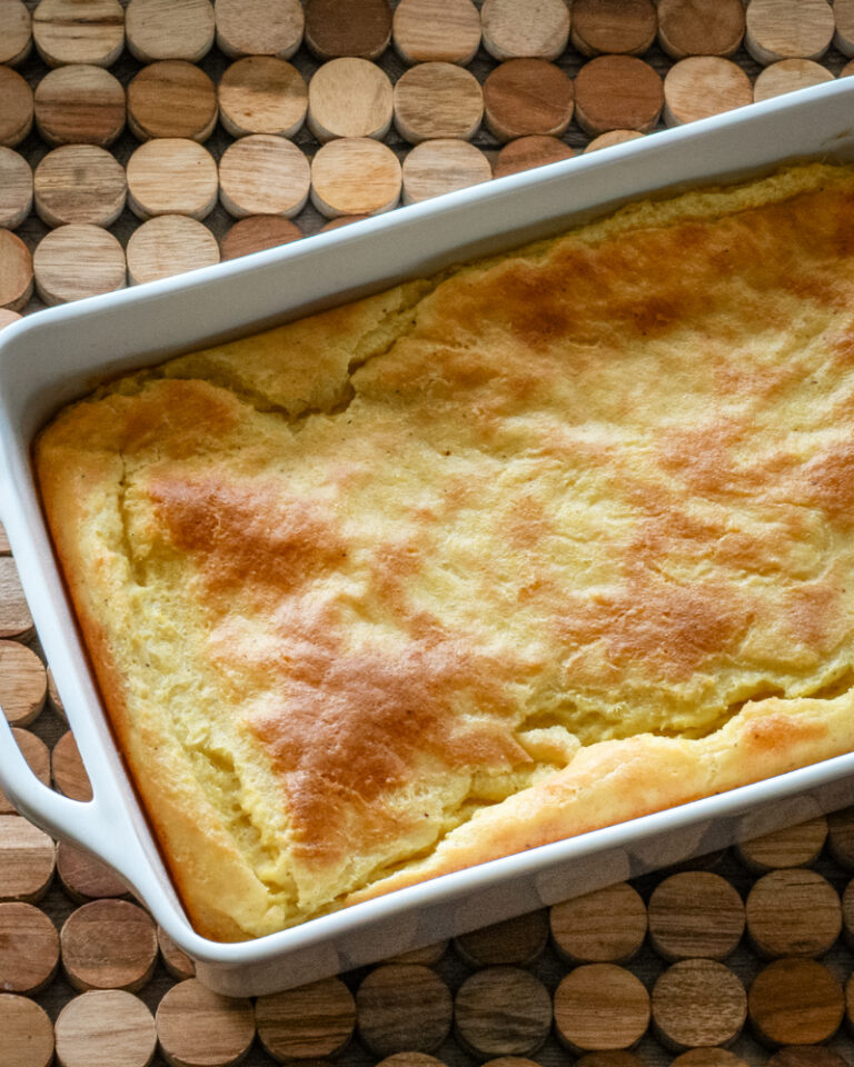 A baking dish with old-fashioned spoonbread, baked