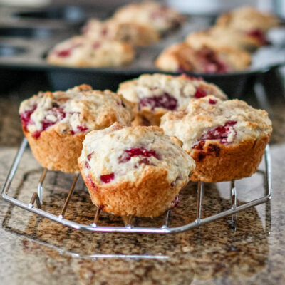 Raspberry muffins on a cooling rack.