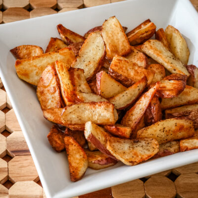 roasted potato wedges in a serving bowl