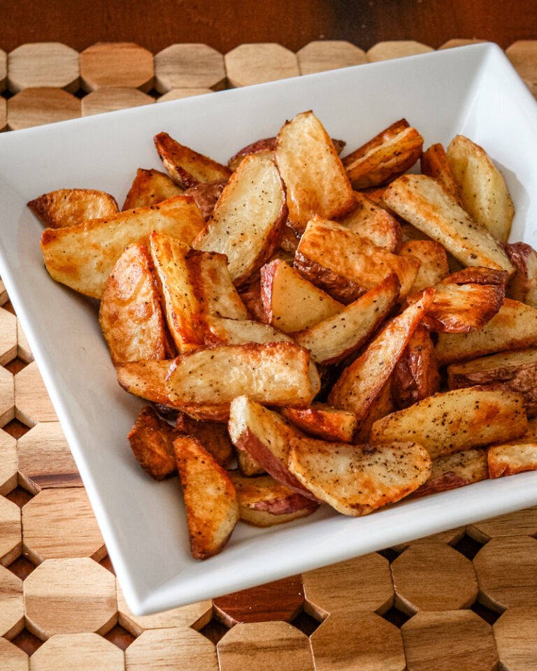 roasted potato wedges in a serving bowl