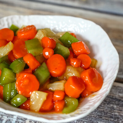 a serving bowl with sweet and sour carrots