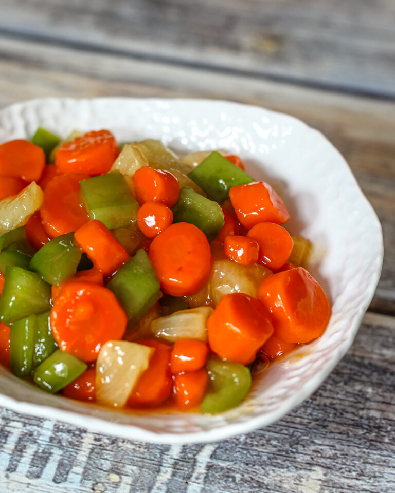a serving bowl with sweet and sour carrots