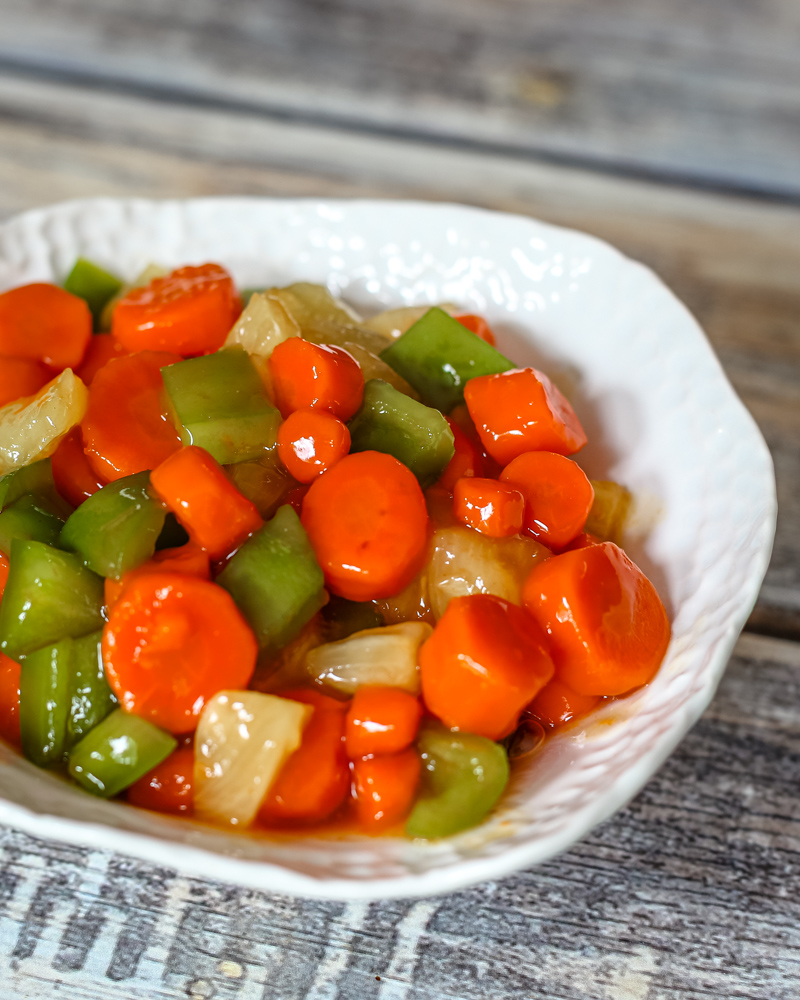 a serving bowl with sweet and sour carrots