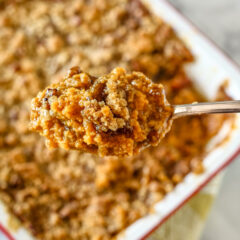 A delicious sweet potato casserole with brown sugar, pecans, and coconut.