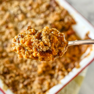 A delicious sweet potato casserole with brown sugar, pecans, and coconut.