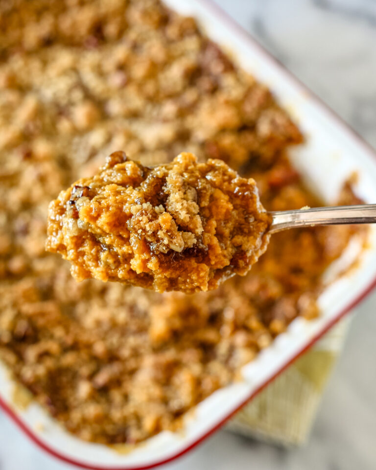 A delicious sweet potato casserole with brown sugar, pecans, and coconut.