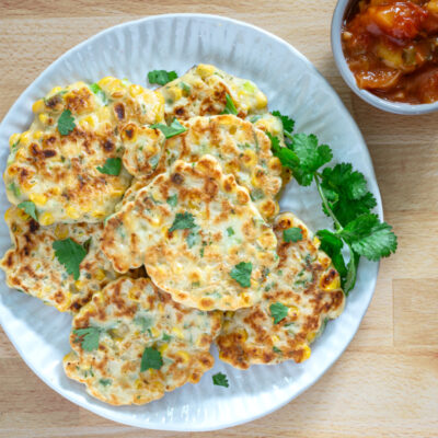 tex mex fritters on a plate with cilantro