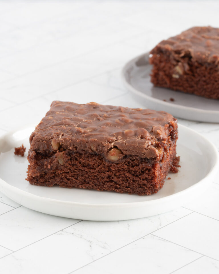 Sliced Texas sheet cake on plates.