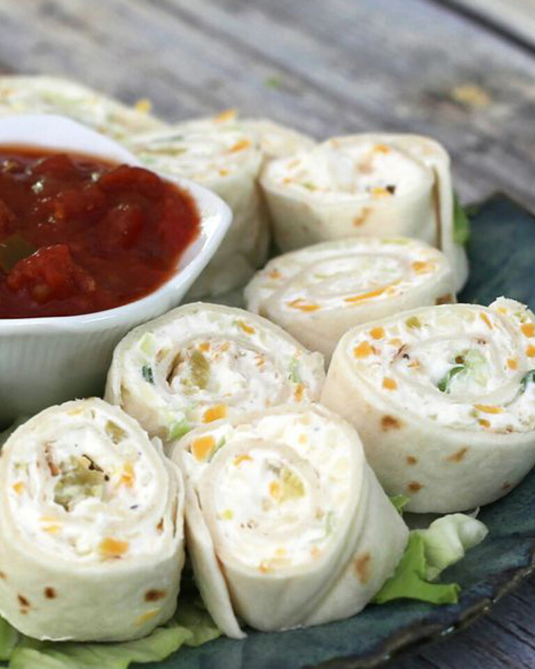 Tortilla roll-ups with salsa for serving