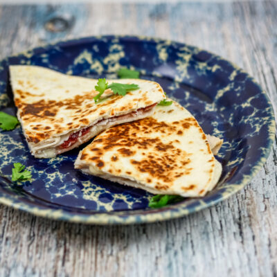 Leftover turkey quesadilla with cranberry sauce and brie.