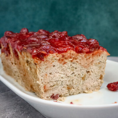 A sliced turkey meatloaf on a plate.