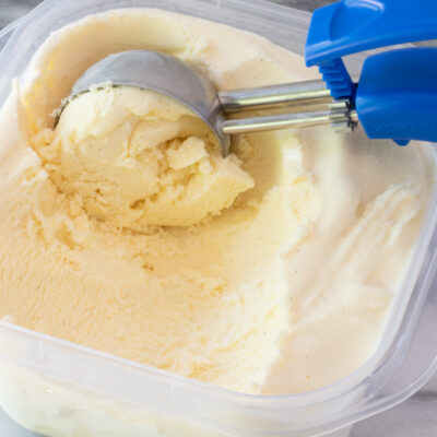 Vanilla ice cream with a scoop.