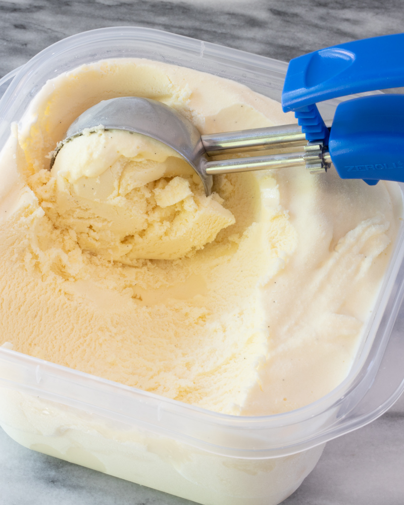 Vanilla ice cream with a scoop.