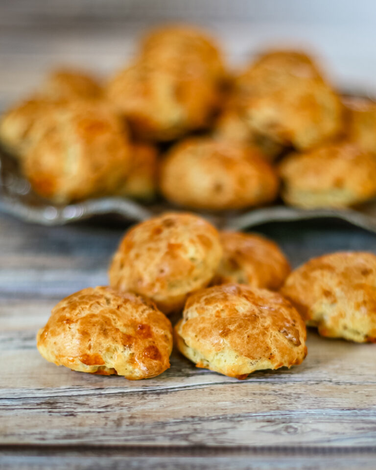 Cheese and bacon puffs on a plate.