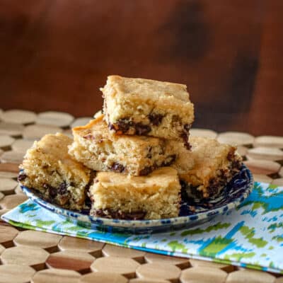A stack of butterscotch bars on a plate.