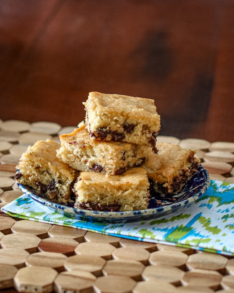 A stack of butterscotch bars on a plate.