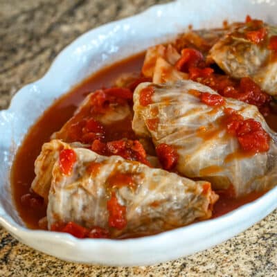 A serving dish with cabbage rolls.