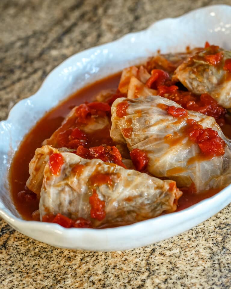 A serving dish with cabbage rolls.
