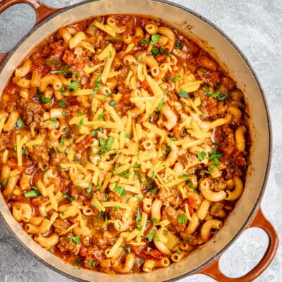 A pot of classic American style goulash with cheese topping.