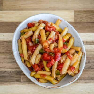 Creole-style wax beans with tomatoes in a a small dish.