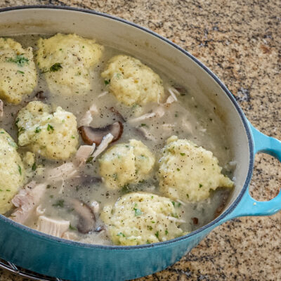 Drop dumplings in chicken stew.
