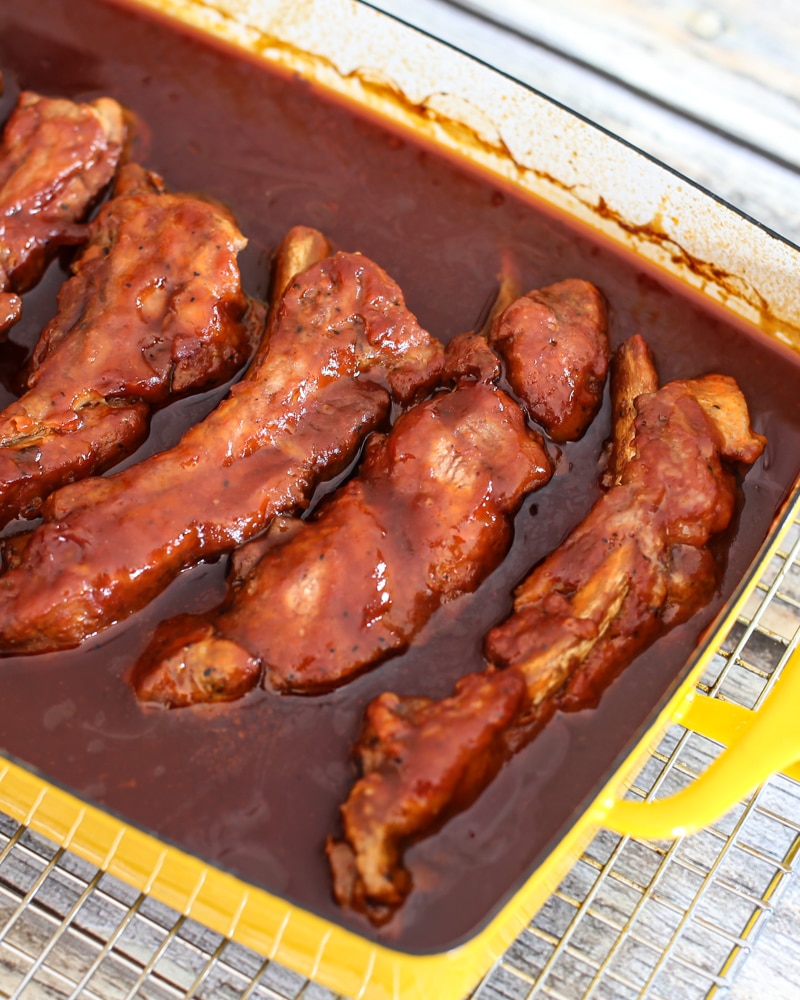 Pork spareribs in a baking pan.