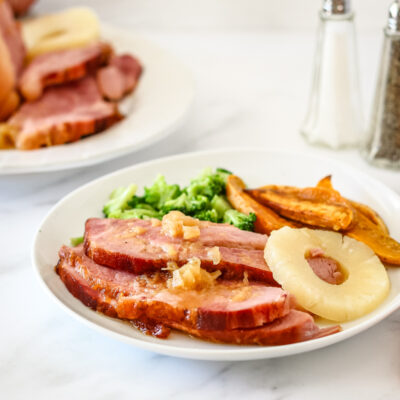 Sliced baked ham on a plate.