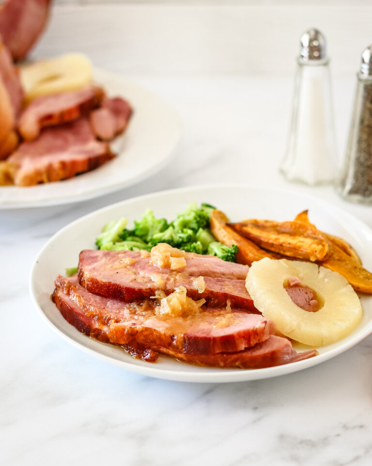 Sliced baked ham on a plate.