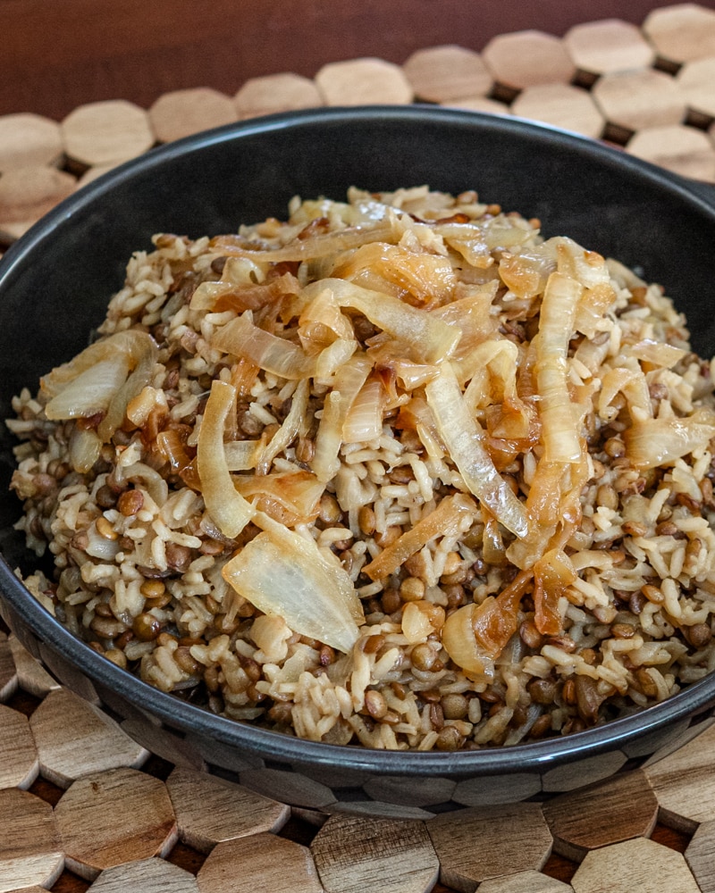 A dish of mujadara with lentils, rice, and onions.