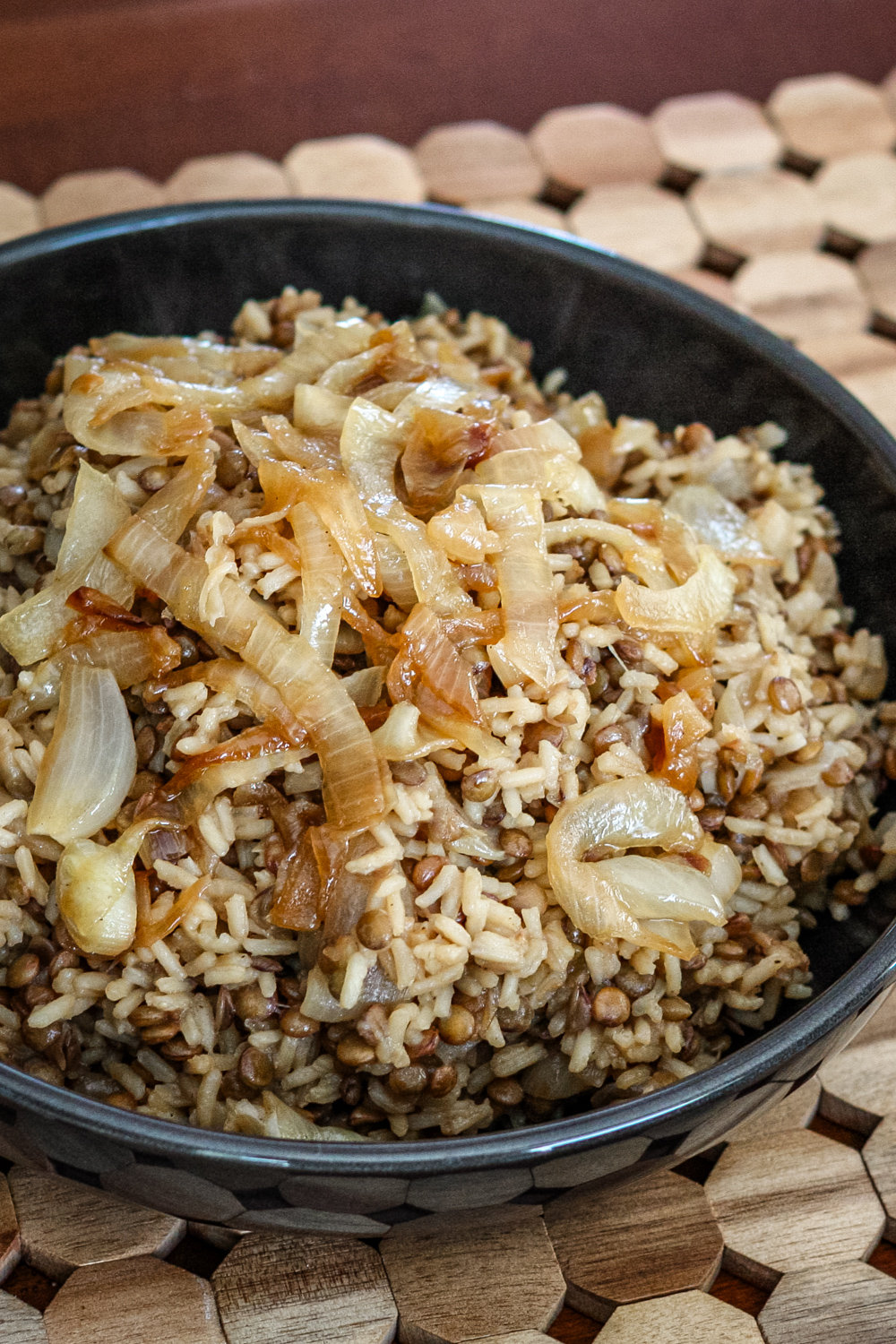 A plate of mujadara, lentils and rice with caramelized onions.