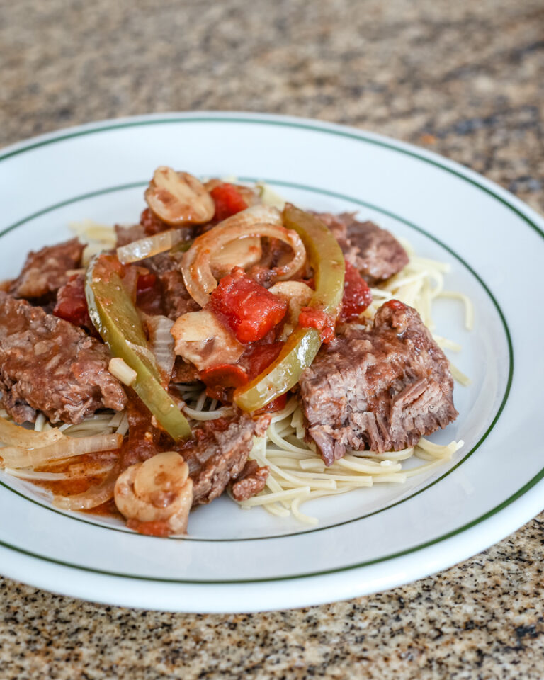 Pepper steak strips with tomatoes, onions, and bell peppers.