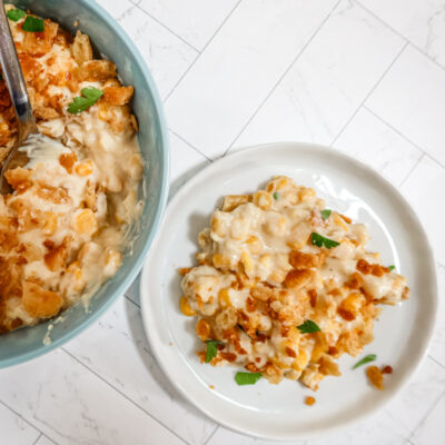 A bowl of scalloped corn with crumb topping.